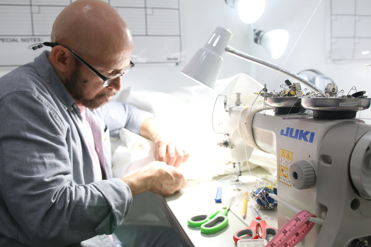 Diego sewing a Pantora gown