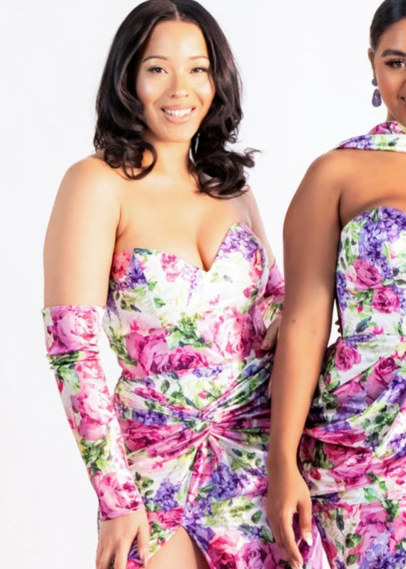 Pink floral print slip-on sleeve paired with a floral strapless dress, close-up