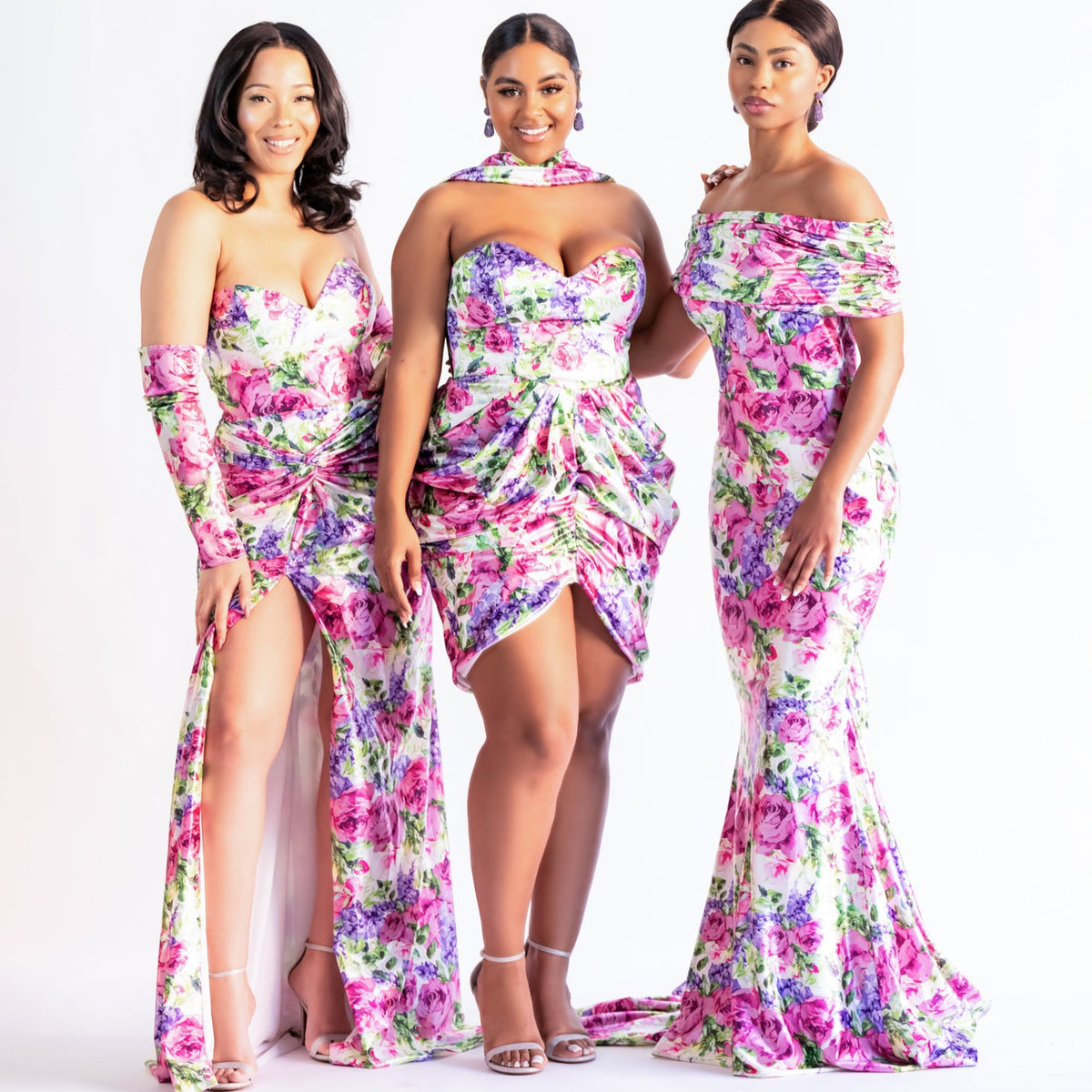 Bridesmaids in pink floral print dresses styled with a slip-on sleeve add-on