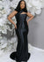 Full-length shiny black gown with the modern asymmetrical neckline on the bridesmaid. Featuring stretch satin, this style is designed to flatter and complement all body types. Shown on a black curvy model.