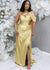 Gold fitted stretch satin bridesmaid dress with one shoulder detailing, keyhole neckline, ruching at the hip and slit at the leg on plus size curvy model