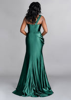 Sexy fitted stretch satin bridesmaid dress with one shoulder detailing, ruching, and keyhole neckline on curvy black model - back view