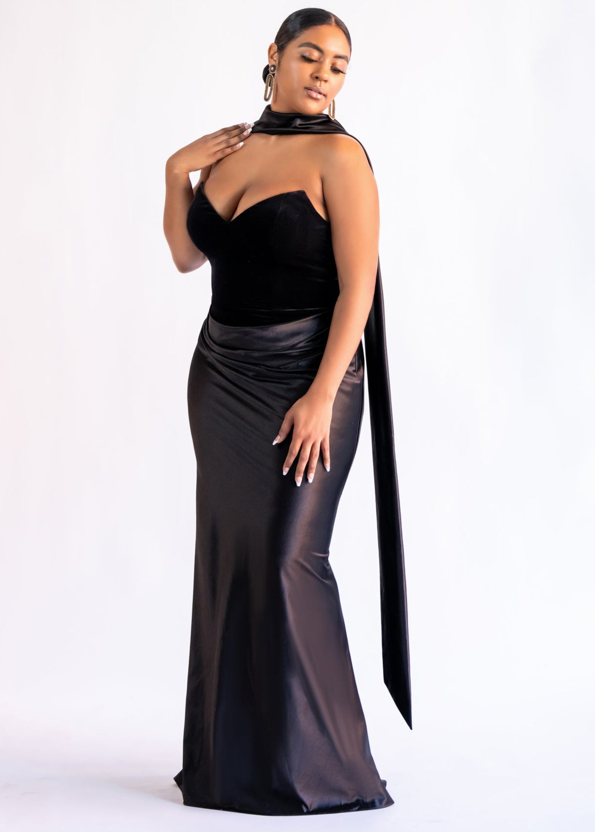 Lux Scarf in black satin worn around the neck and draped down the back of a black strapless gown