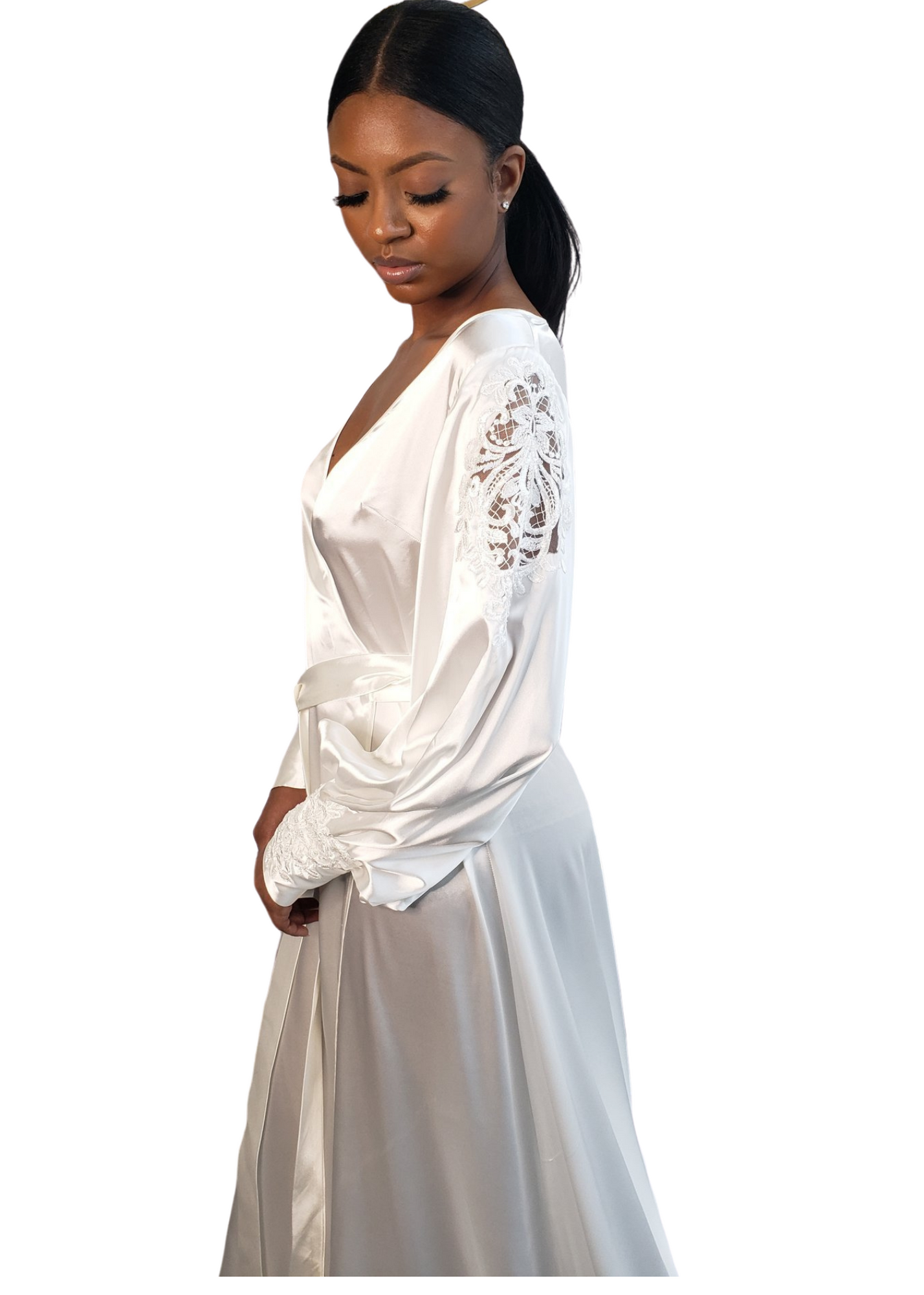 Side view of black female wearing long white satin robe with long sleeves, lace detailing, and tie waist