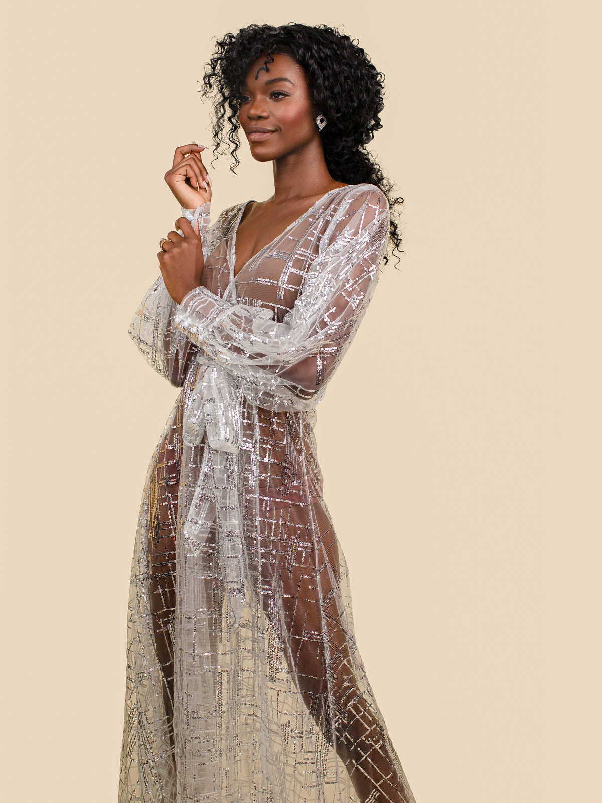 Black female model wearing long sheer glitter sparkle mesh robe with long sleeves and tie waist