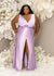 Plus size curvy black bridesmaid wearing a column twist front bridesmaid dress with plunging V-neck and center front slit.