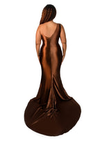 Plus size bridesmaid in asymmetrical fit and flare stretch satin bridesmaid dress with pleated bodice and hugs the hips. Shown in a deep chocolate on a plus size black model. - back view
