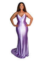 Plus size black bridesmaid wearing a fitted spaghetti strap v-neck bridesmaid dress with stretch to flaunt curves