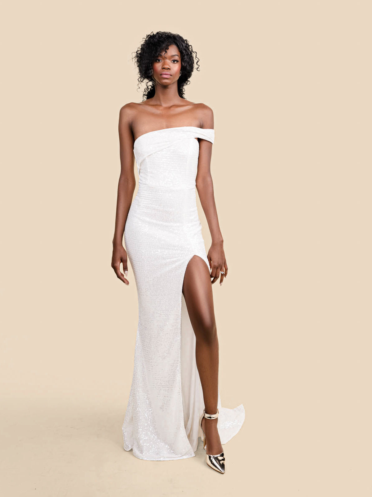 Sexy floor-length sequin one-shoulder dress with leg slit. Perfect for the bride as a bridal outfit option as a reception dress, bachelorette, welcome party outfit, getaway dress, and more! May require alterations.